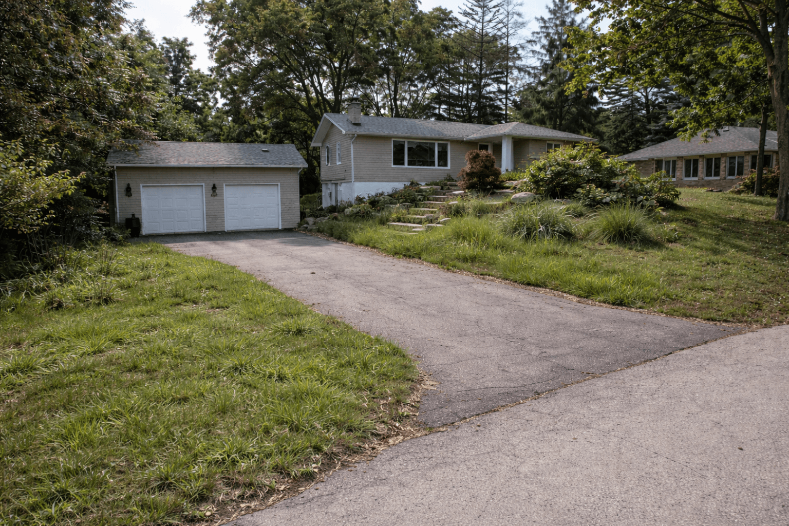 Complex grade front yard before landscaping and interlocking installation in Rockwood Ontario